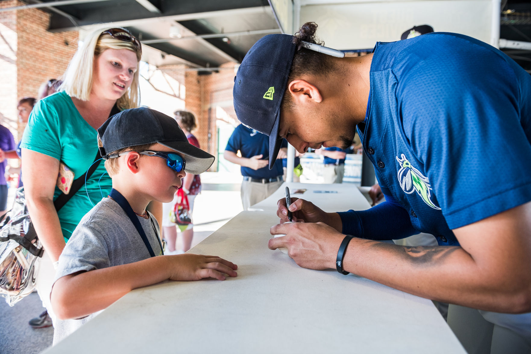 Columbia Fireflies pitcher Jose Butto signs an autograph